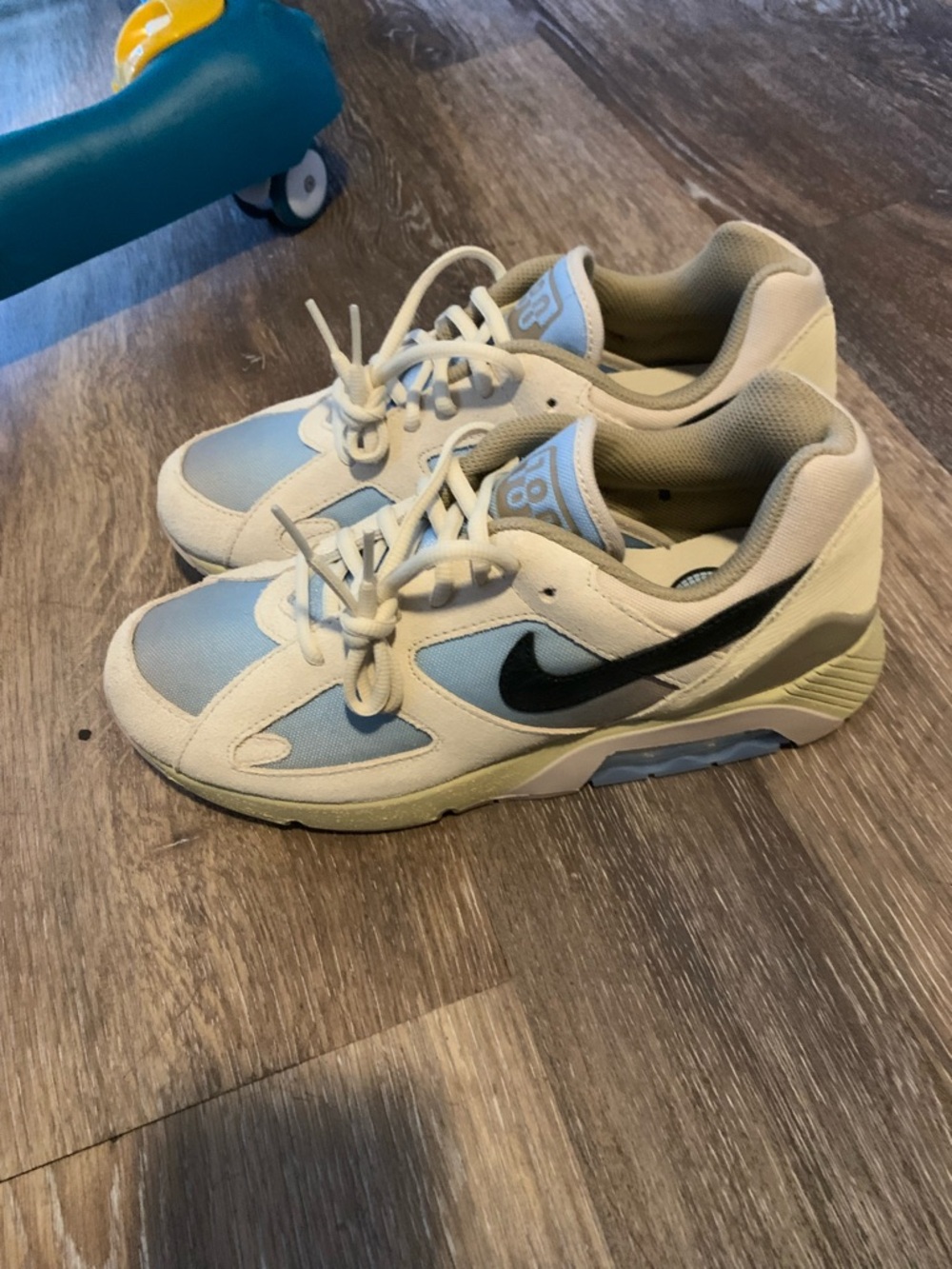 Nike Cream and Light Blue Sneakers with Black Swoosh